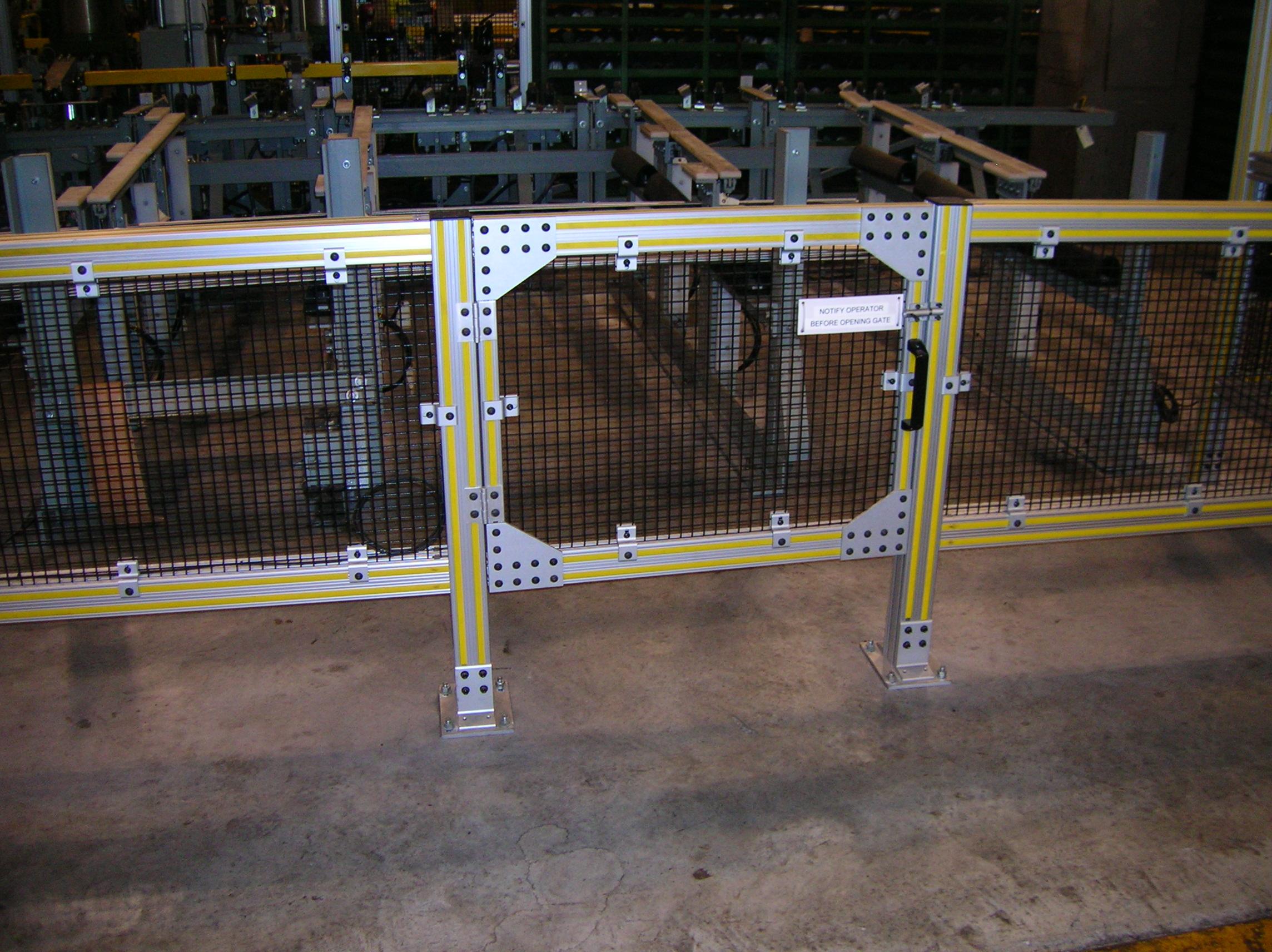 T-slotted 80_20 aluminum cage surrounding production area3